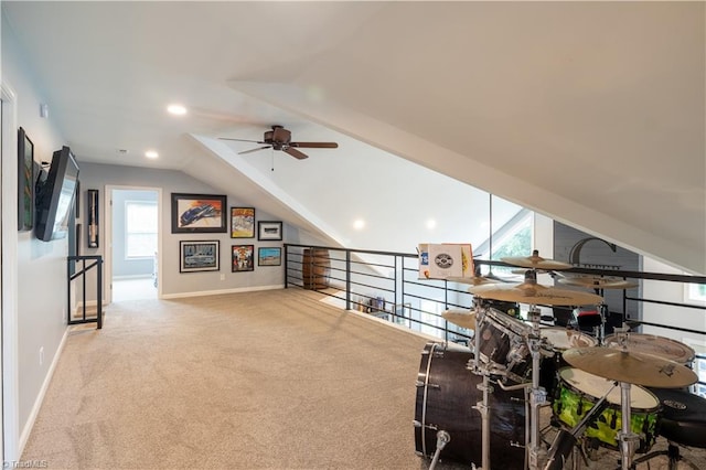 bonus room with light carpet, ceiling fan, and vaulted ceiling