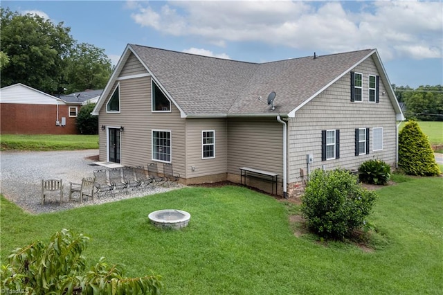 rear view of house with a yard