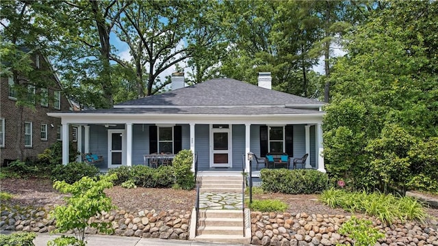 809 Simpson St, Greensboro, NC 27401 - view of front of house featuring a chimney and a porch