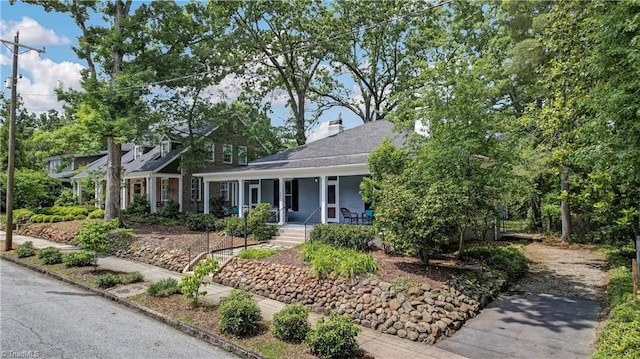 809 Simpson St, Greensboro, NC 27401 - view of front of home featuring covered porch and a chimney