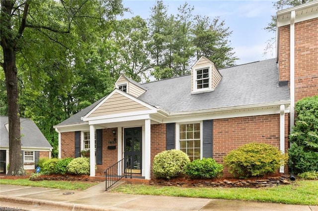 2704 Saint Johns Pl, Winston-Salem, NC 27106 - view of front of home with brick siding and a shingled roof