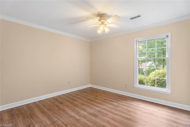 2704 Saint Johns Pl, Winston-Salem, NC 27106 - unfurnished room with crown molding, baseboards, wood finished floors, and a ceiling fan