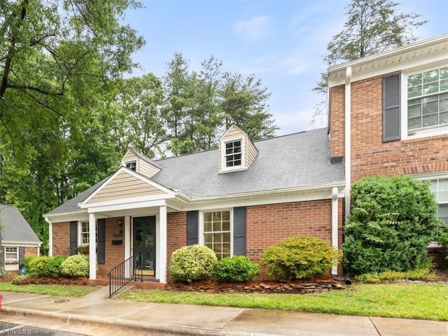 2704 Saint Johns Pl, Winston-Salem, NC 27106 - view of front facade with brick siding and a shingled roof