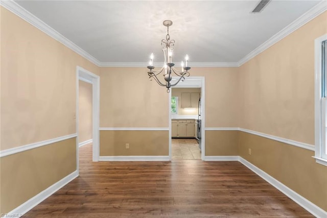 2704 Saint Johns Pl, Winston-Salem, NC 27106 - unfurnished dining area with a chandelier, dark wood-type flooring, crown molding, and baseboards