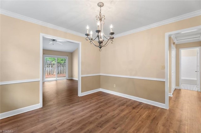 2704 Saint Johns Pl, Winston-Salem, NC 27106 - empty room featuring crown molding, wood finished floors, baseboards, and a chandelier