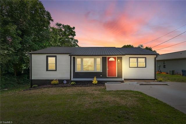 705 Laurel Ave, Lexington, NC 27292 - ranch-style home featuring a front lawn, covered porch, metal roof, and central air condition unit