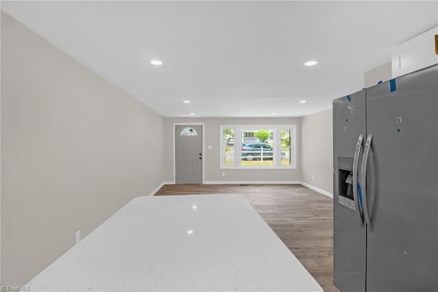 705 Laurel Ave, Lexington, NC 27292 - kitchen with stainless steel fridge, light wood finished floors, recessed lighting, baseboards, and a fireplace