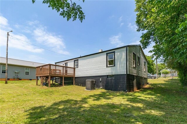 705 Laurel Ave, Lexington, NC 27292 - back of property with a deck, central air condition unit, a lawn, and stairway