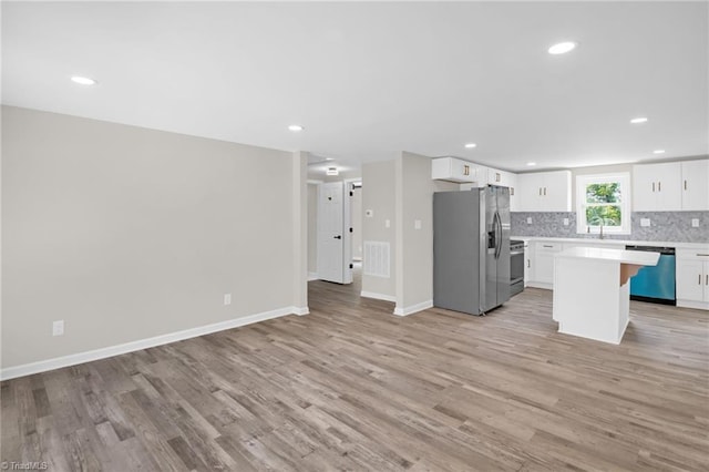 705 Laurel Ave, Lexington, NC 27292 - kitchen featuring stainless steel appliances, light wood-type flooring, light countertops, open floor plan, and recessed lighting