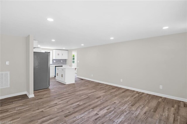 705 Laurel Ave, Lexington, NC 27292 - unfurnished living room with light wood-type flooring, recessed lighting, and baseboards