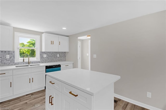 705 Laurel Ave, Lexington, NC 27292 - kitchen with a sink, light wood finished floors, light countertops, tasteful backsplash, and recessed lighting