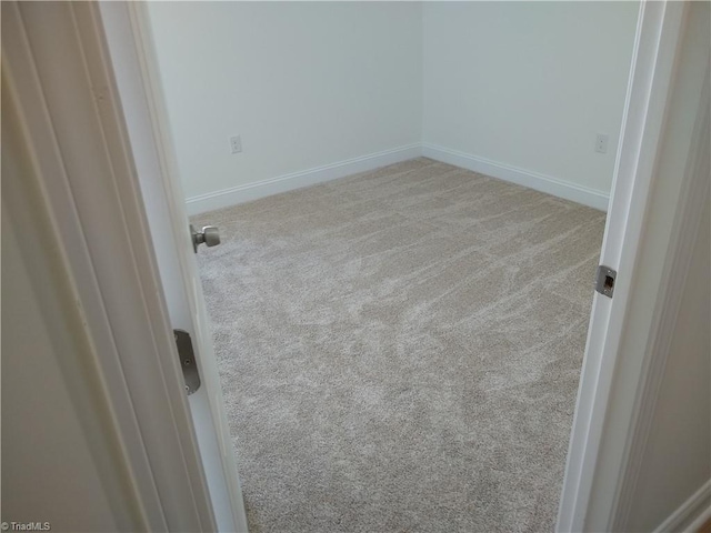 spare room with light carpet