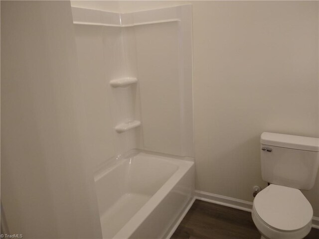 bathroom with toilet and hardwood / wood-style flooring