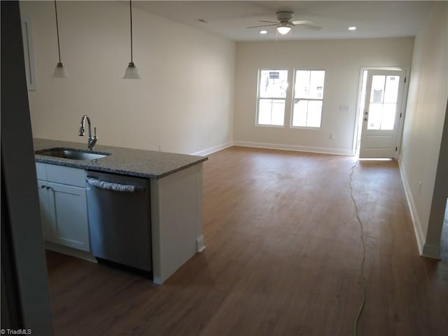 kitchen with sink, white cabinets, dishwasher, hanging light fixtures, and dark hardwood / wood-style floors