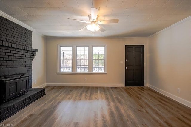 unfurnished living room with crown molding, wood finished floors, a ceiling fan, and baseboards