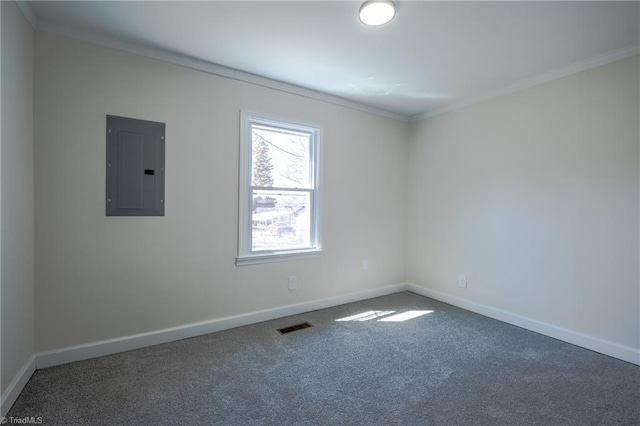 carpeted spare room with electric panel, baseboards, visible vents, and ornamental molding