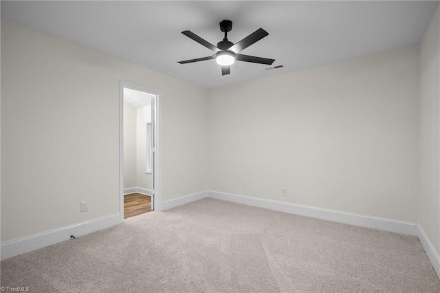 unfurnished room featuring carpet flooring and ceiling fan