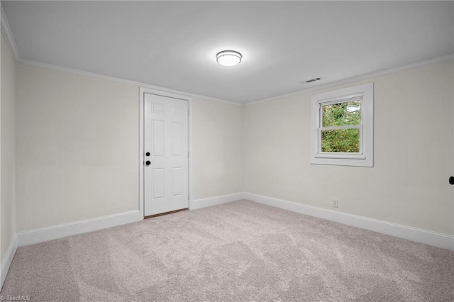 unfurnished room with carpet flooring and ornamental molding