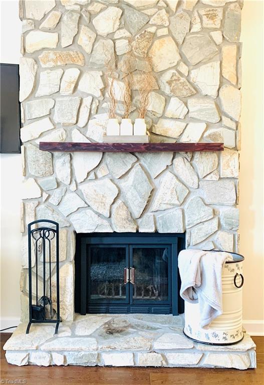 301 Pinnacle Inn Rd Unit 4315, Beech Mountain, NC 28604 - detailed view of a stone fireplace, wood finished floors, and baseboards