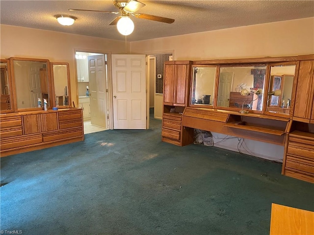 bedroom featuring connected bathroom, a textured ceiling, and carpet flooring