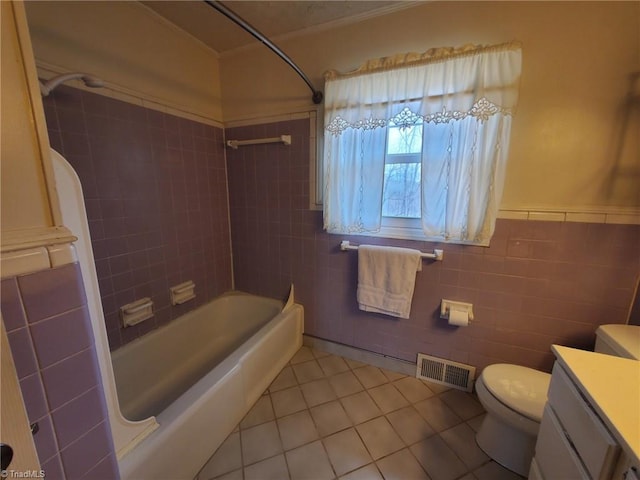 full bath with visible vents, toilet, tile walls, tile patterned flooring, and vanity