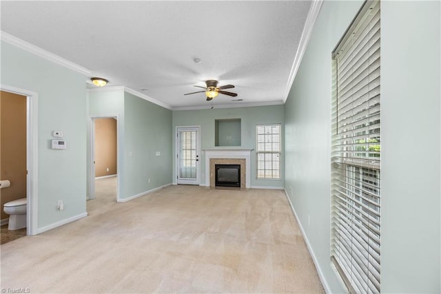 4339 Alderny Pl, High Point, NC 27265 - unfurnished living room featuring crown molding, ceiling fan, light colored carpet, a fireplace with flush hearth, and baseboards