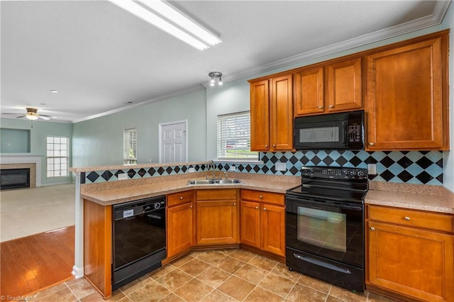 4339 Alderny Pl, High Point, NC 27265 - kitchen featuring black appliances, ornamental molding, ceiling fan, a sink, and brown cabinets