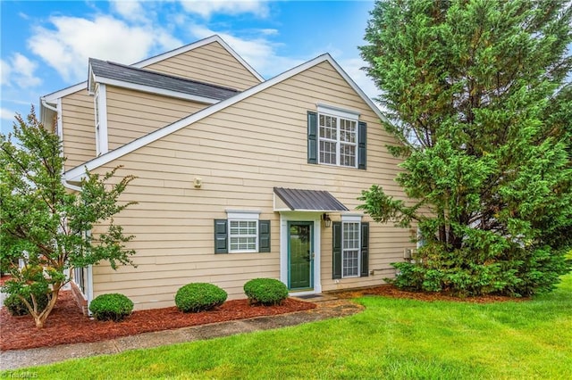 4339 Alderny Pl, High Point, NC 27265 - view of front of house with a front yard and metal roof
