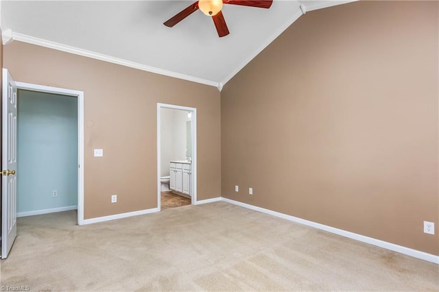 4339 Alderny Pl, High Point, NC 27265 - unfurnished bedroom with ornamental molding, light colored carpet, vaulted ceiling, baseboards, and ensuite bathroom