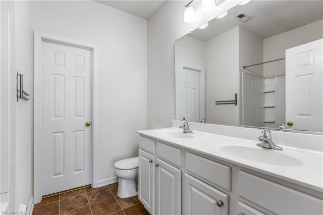 4339 Alderny Pl, High Point, NC 27265 - bathroom featuring double vanity, toilet, and a shower