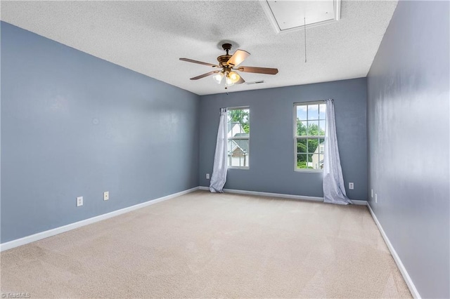 4339 Alderny Pl, High Point, NC 27265 - carpeted empty room with attic access, a textured ceiling, a ceiling fan, and baseboards