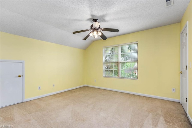 4339 Alderny Pl, High Point, NC 27265 - unfurnished room featuring light carpet, a ceiling fan, lofted ceiling, baseboards, and a textured ceiling