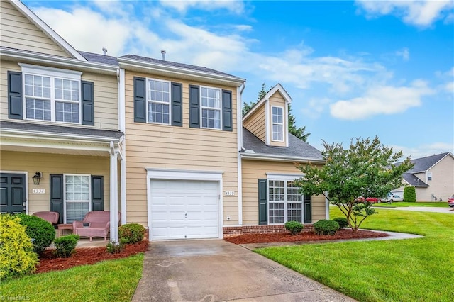 4339 Alderny Pl, High Point, NC 27265 - view of front of house with a front lawn, covered porch, concrete driveway, an attached garage, and brick siding