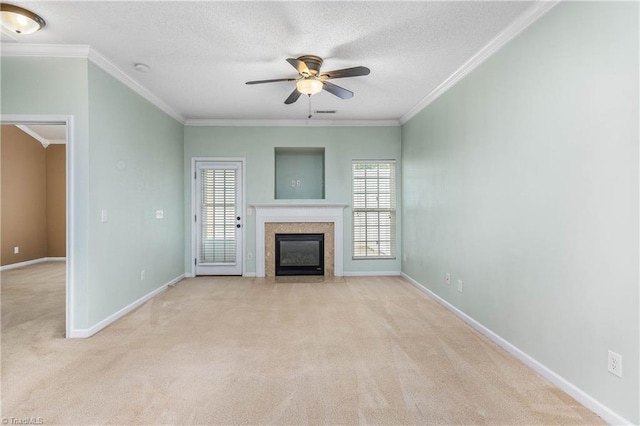 4339 Alderny Pl, High Point, NC 27265 - unfurnished living room featuring carpet floors, plenty of natural light, a ceiling fan, a premium fireplace, and ornamental molding