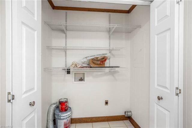 laundry area featuring hookup for a washing machine, baseboards, laundry area, electric dryer hookup, and crown molding