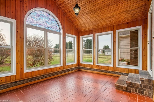 unfurnished sunroom with wood ceiling and vaulted ceiling