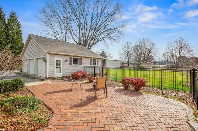 view of patio / terrace with an outbuilding and fence