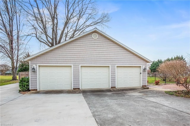 garage featuring fence