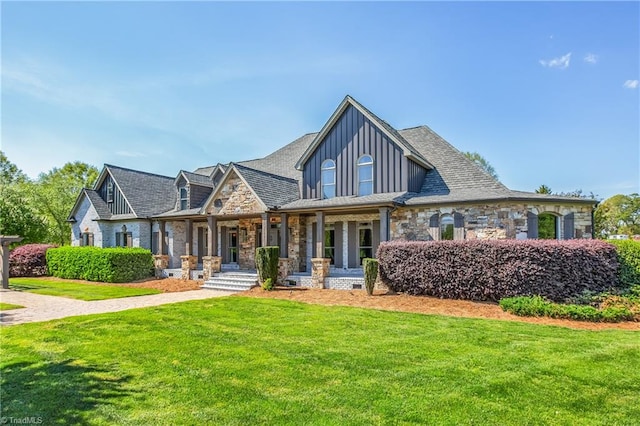 view of front of home with a front lawn and covered porch