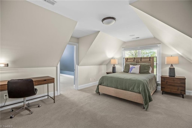 bedroom featuring light colored carpet and vaulted ceiling