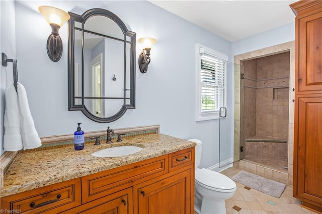 bathroom featuring an enclosed shower, toilet, oversized vanity, and tile floors