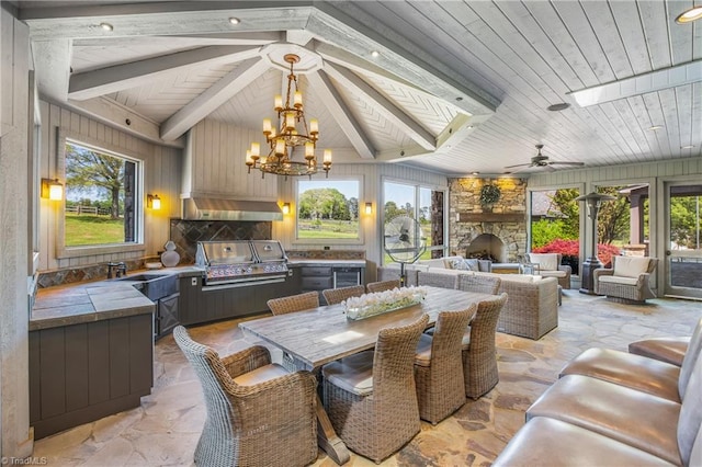 tiled dining room featuring plenty of natural light, wooden ceiling, and a fireplace