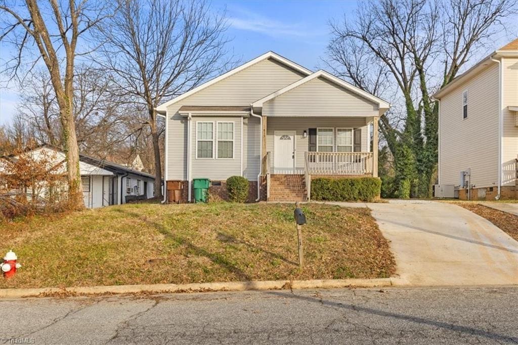 view of front of house with a front lawn and a porch