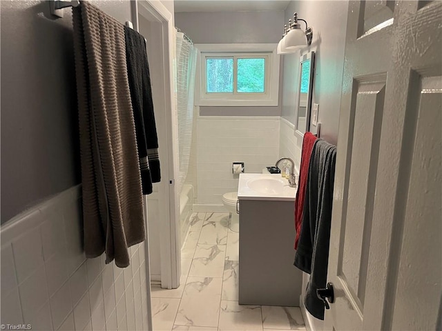 240 Byerly St, Mount Airy, NC 27030 - full bath with marble finish flooring, a wainscoted wall, vanity, toilet, and shower / bath combination with curtain