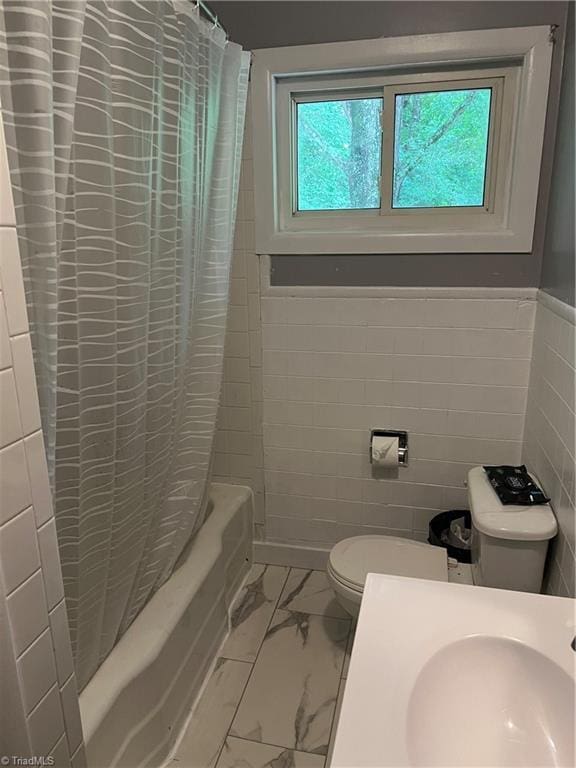 240 Byerly St, Mount Airy, NC 27030 - bathroom featuring tile walls, toilet, shower / bath combo, marble finish flooring, and a wainscoted wall