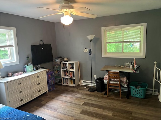 240 Byerly St, Mount Airy, NC 27030 - bedroom with a baseboard heating unit, dark wood-type flooring, a ceiling fan, and baseboards