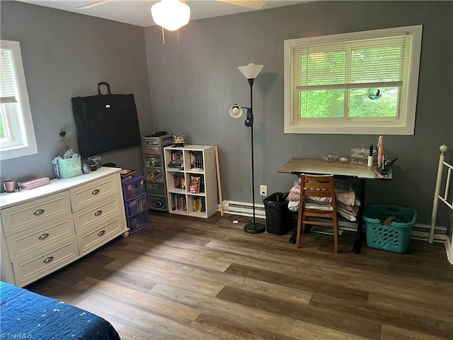 240 Byerly St, Mount Airy, NC 27030 - bedroom with a baseboard radiator, multiple windows, and dark wood-style floors