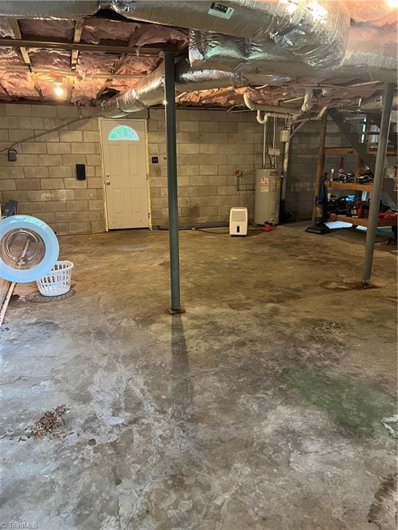 240 Byerly St, Mount Airy, NC 27030 - unfinished below grade area featuring water heater and concrete block wall