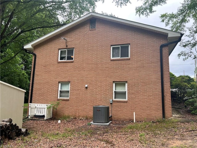240 Byerly St, Mount Airy, NC 27030 - view of side of property featuring central air condition unit and brick siding