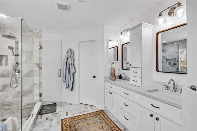 bathroom with crown molding, vanity, and a shower with door